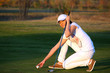 Photo: girl golf player preparing for shot girl golf player preparing for shot