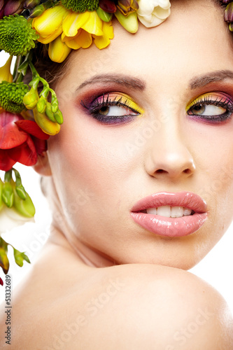 Photo: Woman with hairstyle and freesia flower. Isolated. Woman with hairstyle and freesia flower. Isolated.