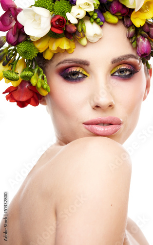 Photo: Woman with hairstyle and freesia flower. Isolated. Woman with hairstyle and freesia flower. Isolated.