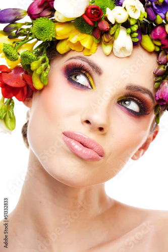 Photo: Woman with hairstyle and freesia flower. Isolated. Woman with hairstyle and freesia flower. Isolated.