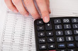 Close-up Of Hand With Calculator