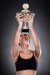 Young Woman Lifting Trophy