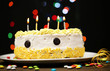 Happy birthday cake, on black background