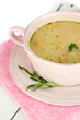 Foto: Nourishing soup with vegetables in pan isolated on white Nourishing soup with vegetables in pan isolated on white