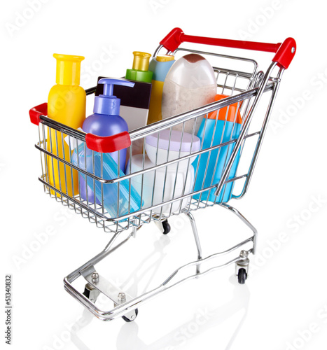 Photo: Cosmetics in cart isolated on white Cosmetics in cart isolated on white