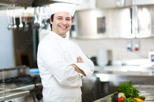 Photo: Chef with arms crossed in restaurant kitchen Chef with arms crossed in restaurant kitchen