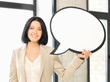 smiling businesswoman with blank text bubble
