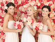 Photo: three women with background full of roses three women with background full of roses