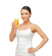 woman holding glass of orange juice