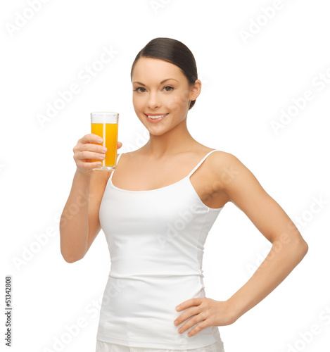 Photo: woman holding glass of orange juice woman holding glass of orange juice