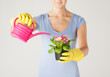 Photo: woman holding pot with flower woman holding pot with flower