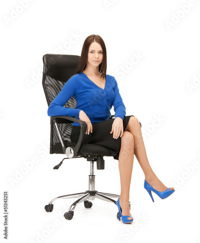 Photo: businesswoman sitting in chair businesswoman sitting in chair