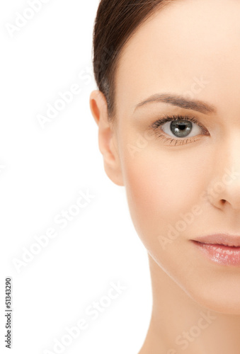 Photo: half face of beautiful woman half face of beautiful woman