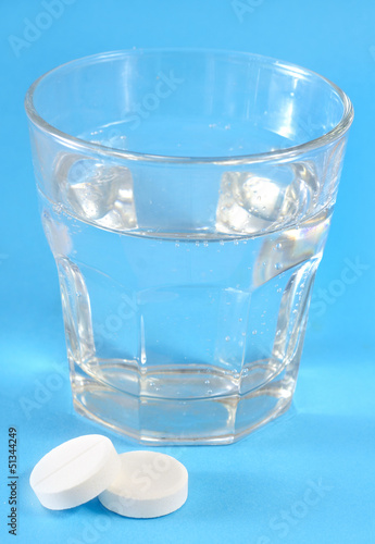 Photo: white pills and water white pills and water