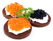Black bread topped with salmon, trout and sturgeon caviar