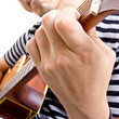 Guiter player picking music in studio