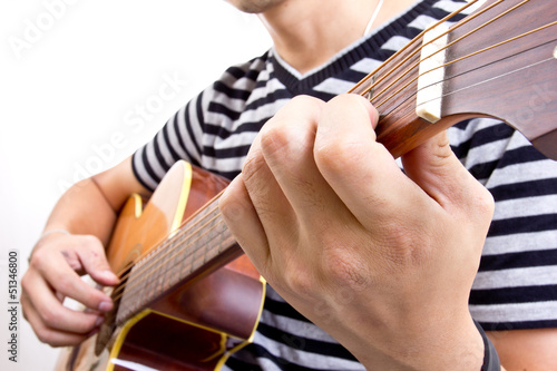 Photo: Guiter player picking music in studio Guiter player picking music in studio
