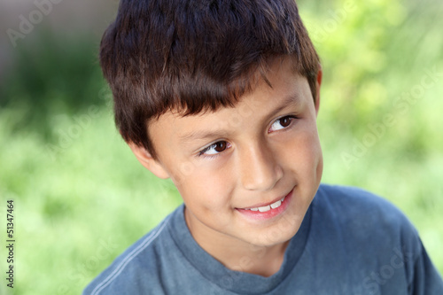Photo: Smiling young boy outside with copy space Smiling young boy outside with copy space