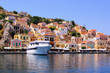 Colorful houses lining the harbor at Symi, Greece