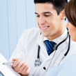 Photo: Portrait of smiling doctor and female patient Portrait of smiling doctor and female patient