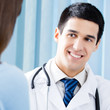 Photo: Portrait of smiling doctor and female patient Portrait of smiling doctor and female patient