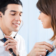 Doctor examing patient with stethoscope