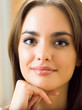Portrait of young woman at home