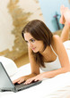 Cheerfull smiling woman working with laptop