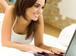 Cheerfull smiling woman working with laptop
