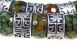 arabic silver and jade beads close up