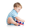kid boy playing with construction set over white background
