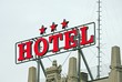 Huge written three star HOTEL above the roof of a building in th