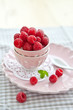 Fresh raspberries in a pink vintage bowl