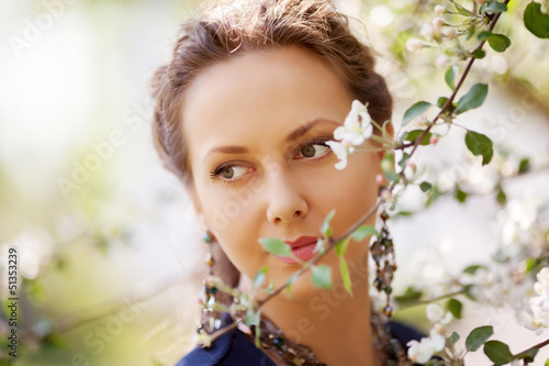 Photo: Beautiful woman in a spring garden Beautiful woman in a spring garden