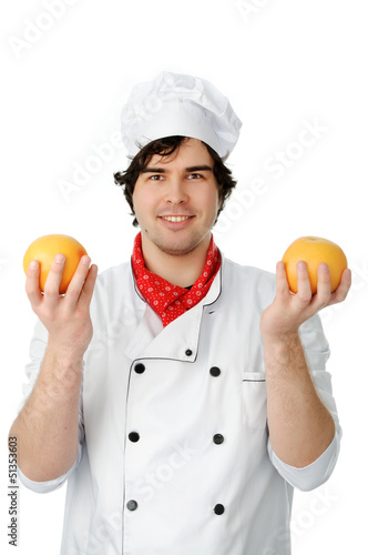 Photo: handsome cook with an orange handsome cook with an orange