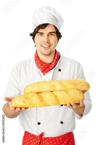 Photo: Cook holding couple breads Cook holding couple breads