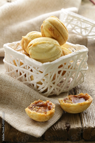 Photo: Cookies in the form of nuts in a white basket Cookies in the form of nuts in a white basket