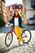 Urban biking - teenage girl and bike in city