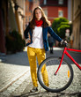 Urban biking - teenage girl and bike in city