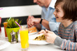 Dad and son in restaurant