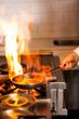 Chef cooking in kitchen stove