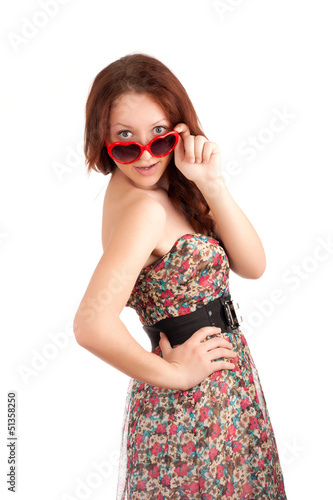 Photo: Young woman with heart shape glasses Young woman with heart shape glasses