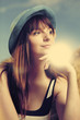 Girl in blue hat enjoying summer
