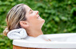 Relaxed woman in a bathtub
