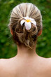 Hairstyle with a flower