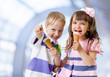 Children with icecream cone in abstract cafe
