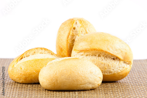 Photo: Bread on a white background. delicious buns isolated on white Bread on a white background. delicious buns isolated on white