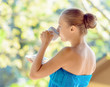 Young woman drinking coffee on morning terrace