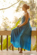 Young woman drinking coffee on morning terrace