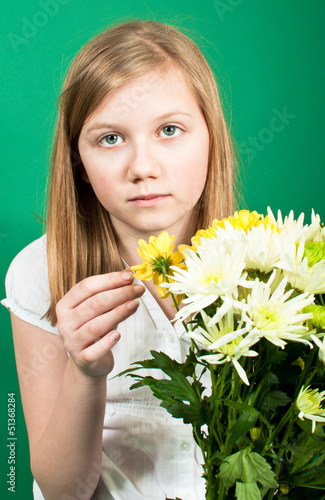Photo: Girl with spring flowers Girl with spring flowers